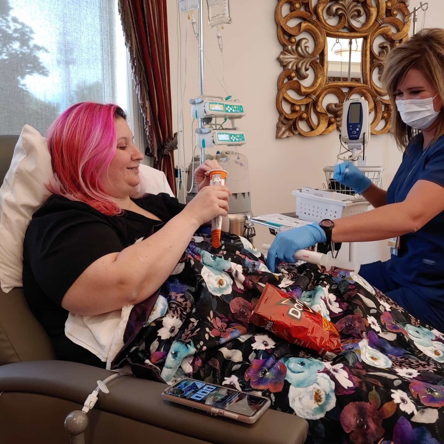 A cancer patient with her nurse at the beginning of her infusion. 